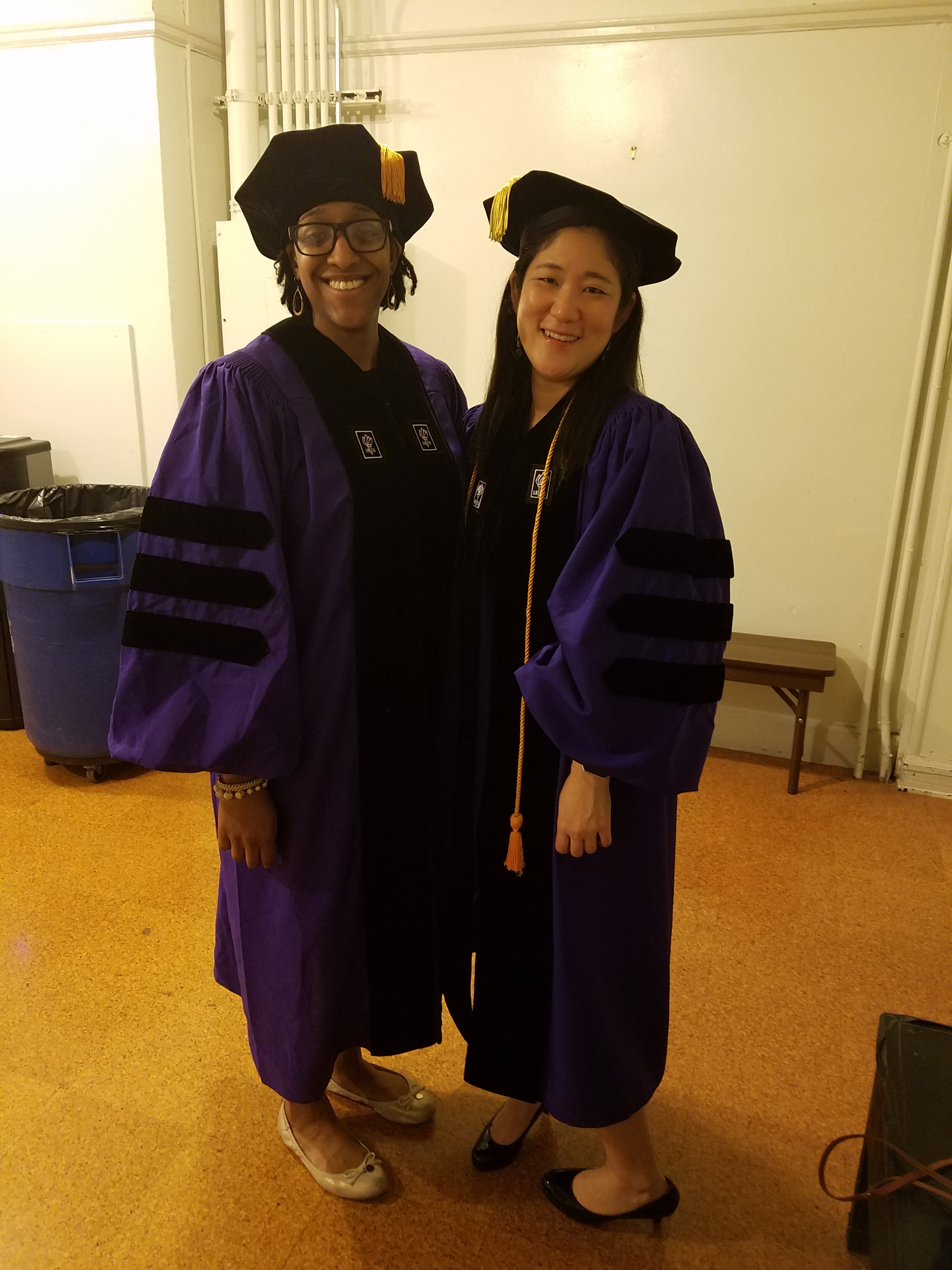 PhD graduates Jin Jun Melissa Ojemeni at graduation