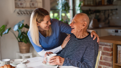 women caring for elderly man
