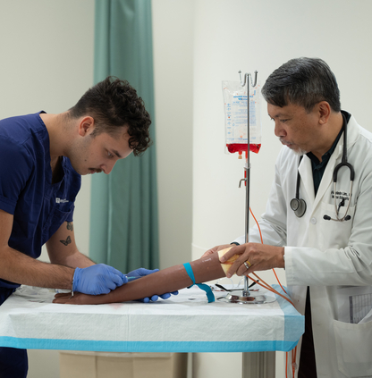 Student and instructor in clinical lab
